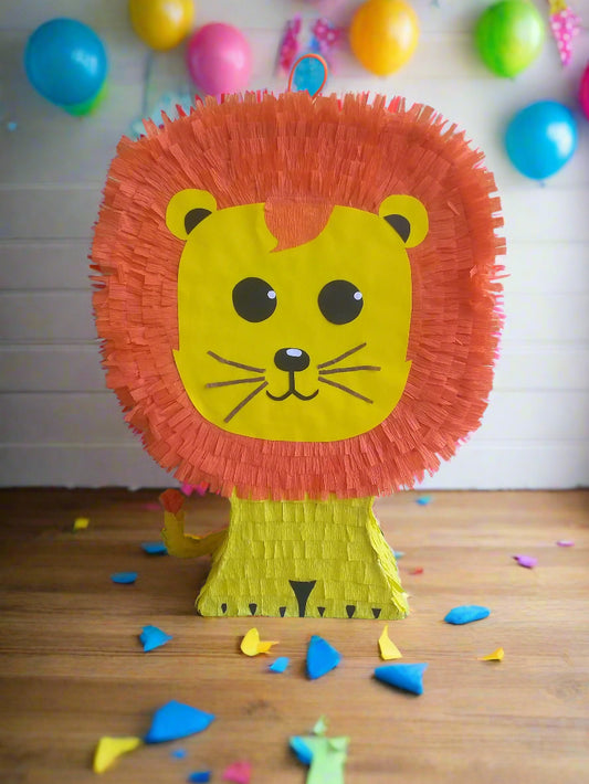 Yellow lion piñata with orange mane on 